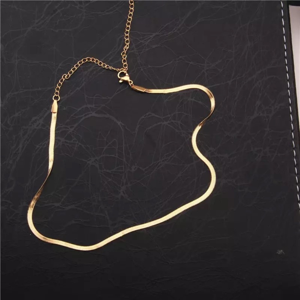 Gold snake chocker.